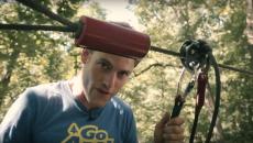 A man preparing to slide down a zipline
