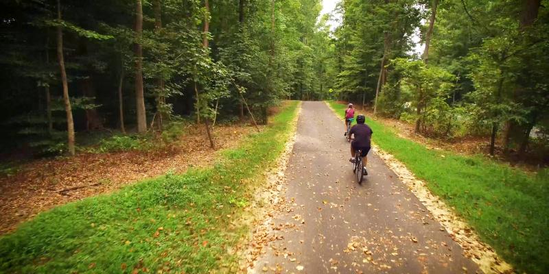 Two cyclists riding the trail