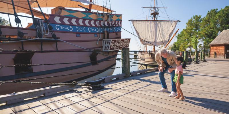 Historical ship recreations at the Jamestown Settlement A kid and parent marvel at the hull of historical 17th-century ships in Jamestown Settlement, Virginia, USA