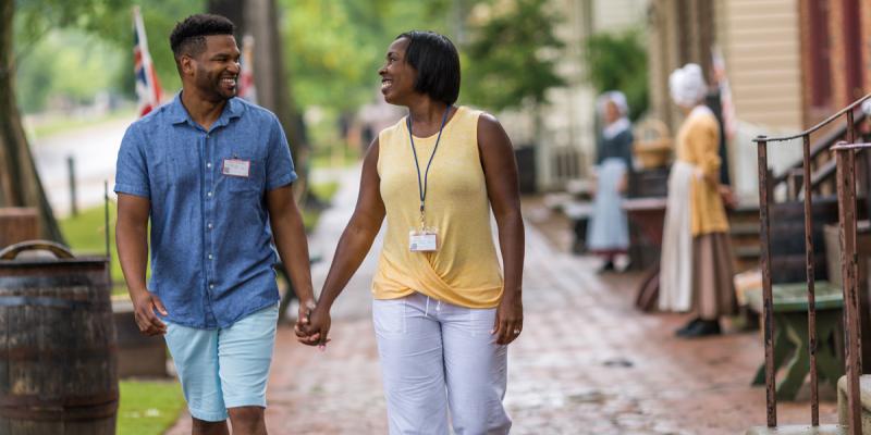 Strolling through Williamsburg, Virginia, USA A couple holds hands as they stroll down the bricked streets of Williamsburg, Virginia, USA