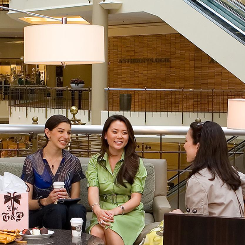 Shoppers sip coffee in a seating area at Tysons Corner Center in Tysons Corner, Virginia.