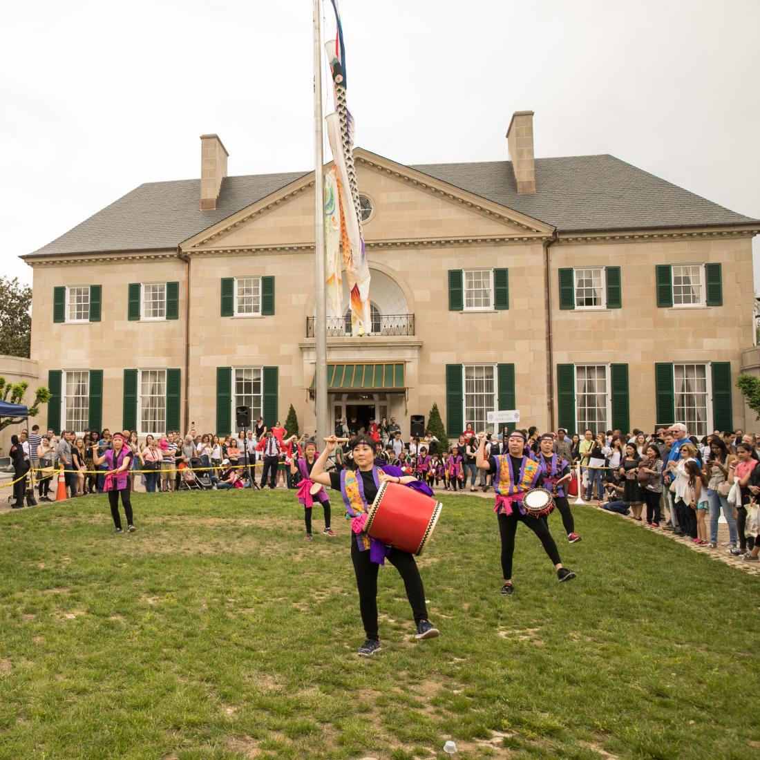 Drummers perform on the lawn