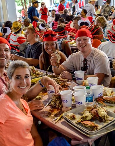 Diners wear crab hats at the Annapolis Crab Feast in Annapolis, Maryland, USA.